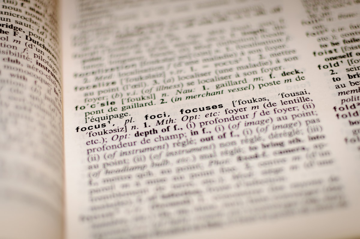 Close-up of dictionary page with academic definitions