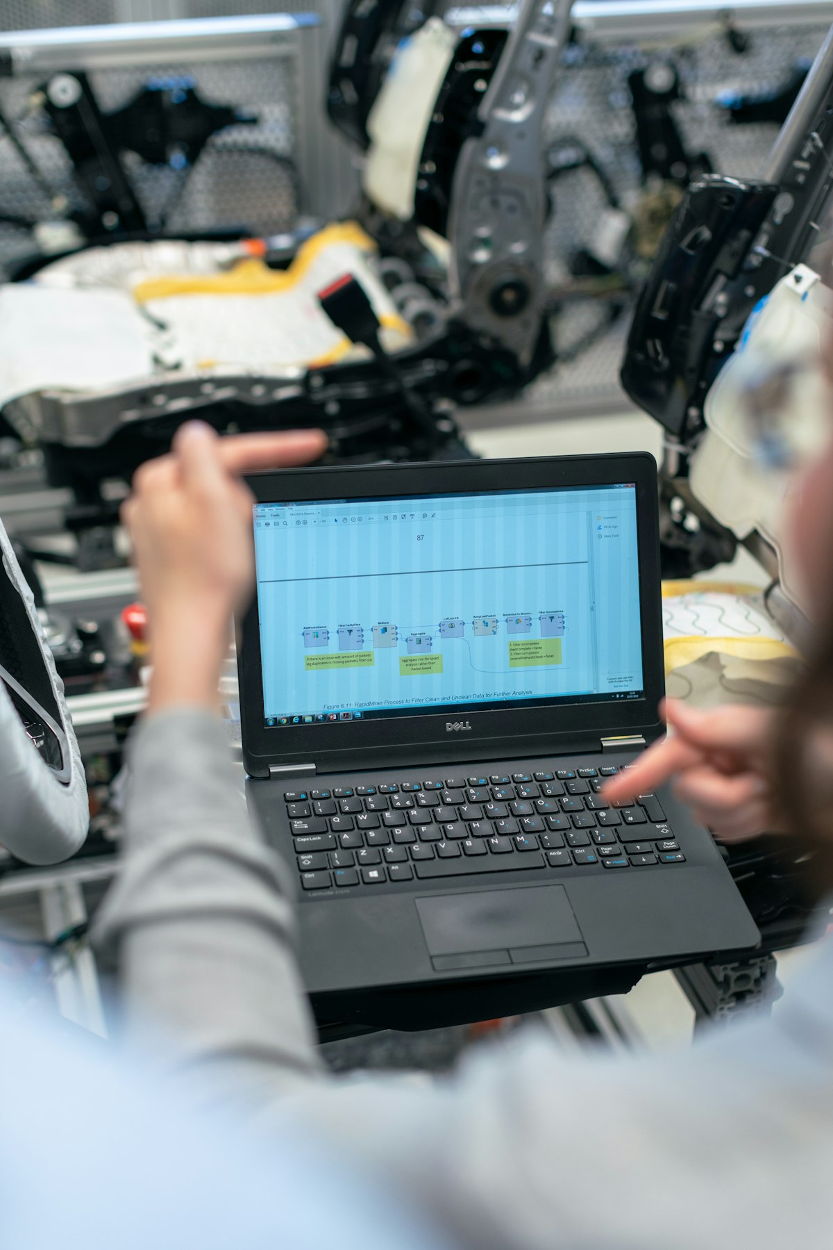 Person working on laptop studying for a technical certification