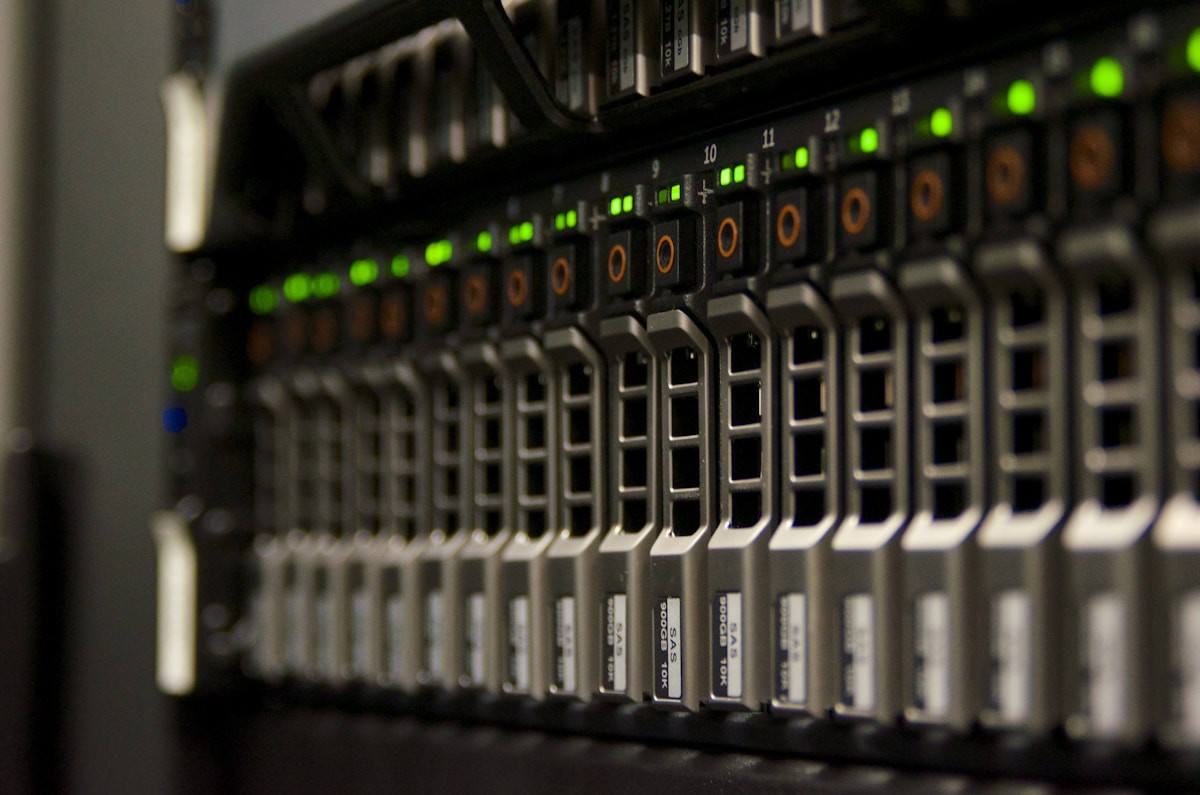 Close-up of a server rack with blinking status lights representing network infrastructure