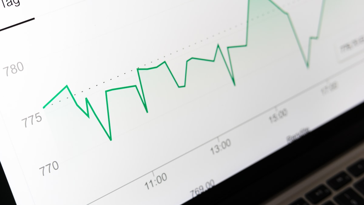 Stock market chart displayed on laptop screen representing CFA financial analysis