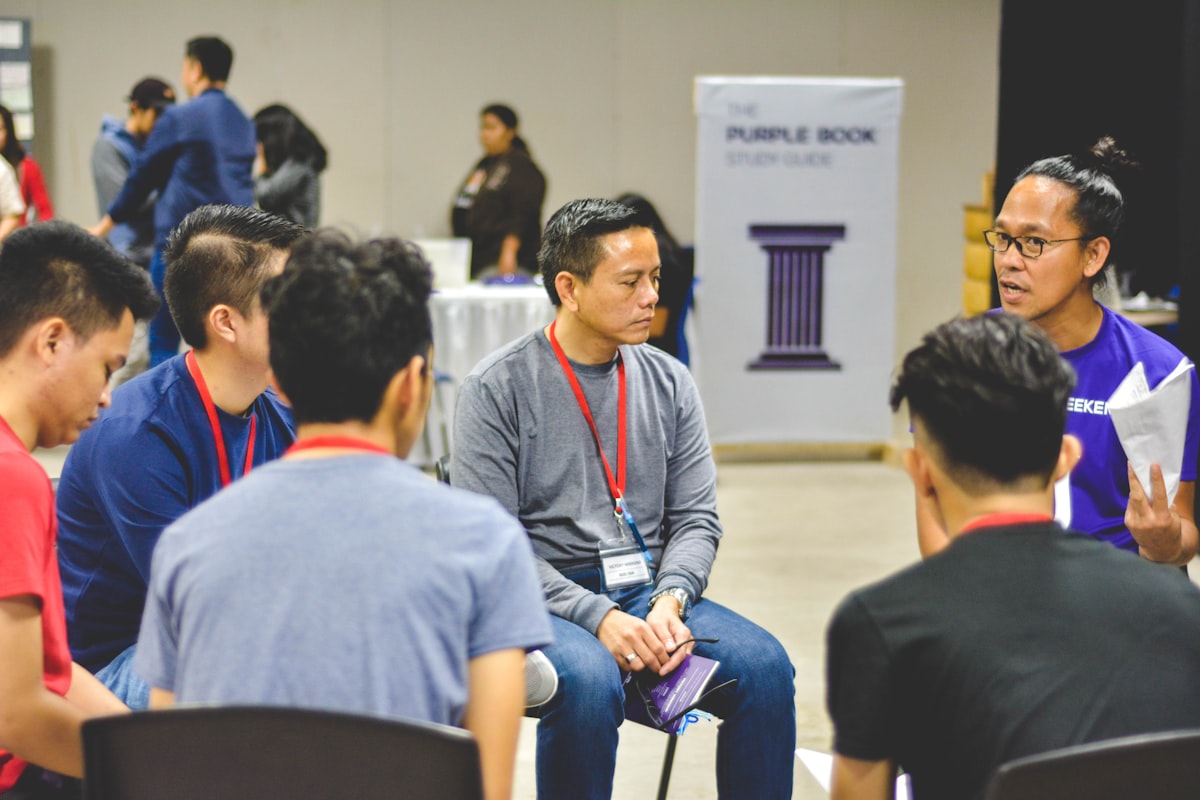 Students engaged in a discussion circle using debate as a study technique