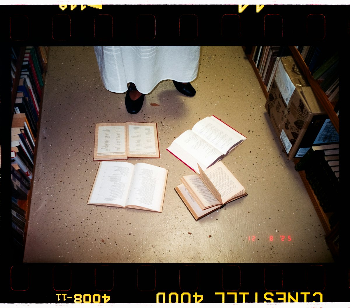 Open books scattered on the floor for studying
