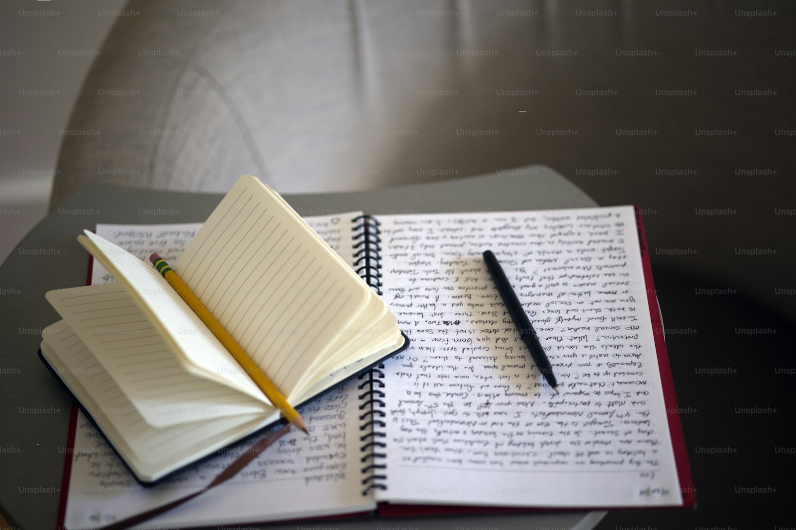 Notebook with handwritten notes and a pen on a desk