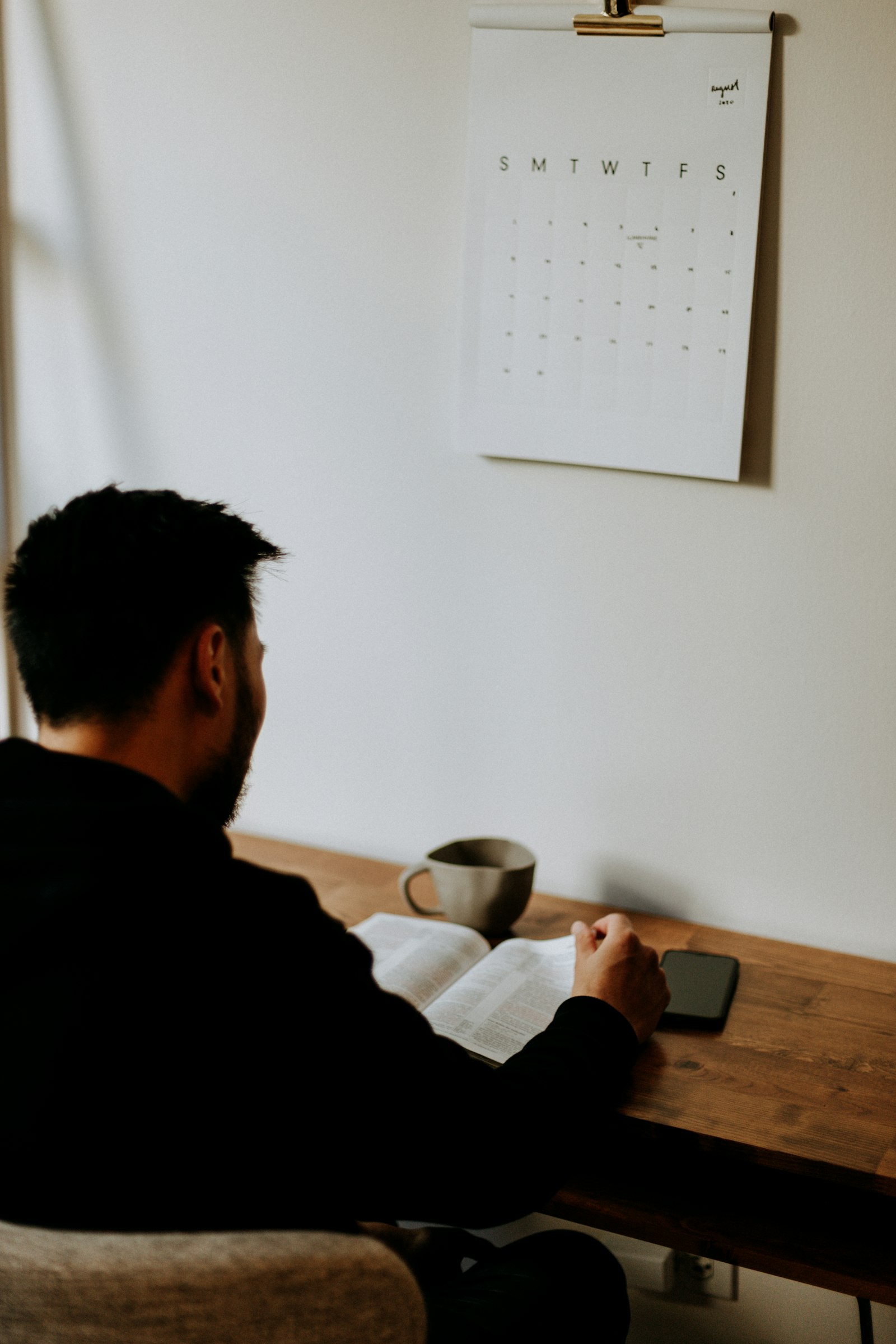 Person sitting at a desk, getting ready to start studying
