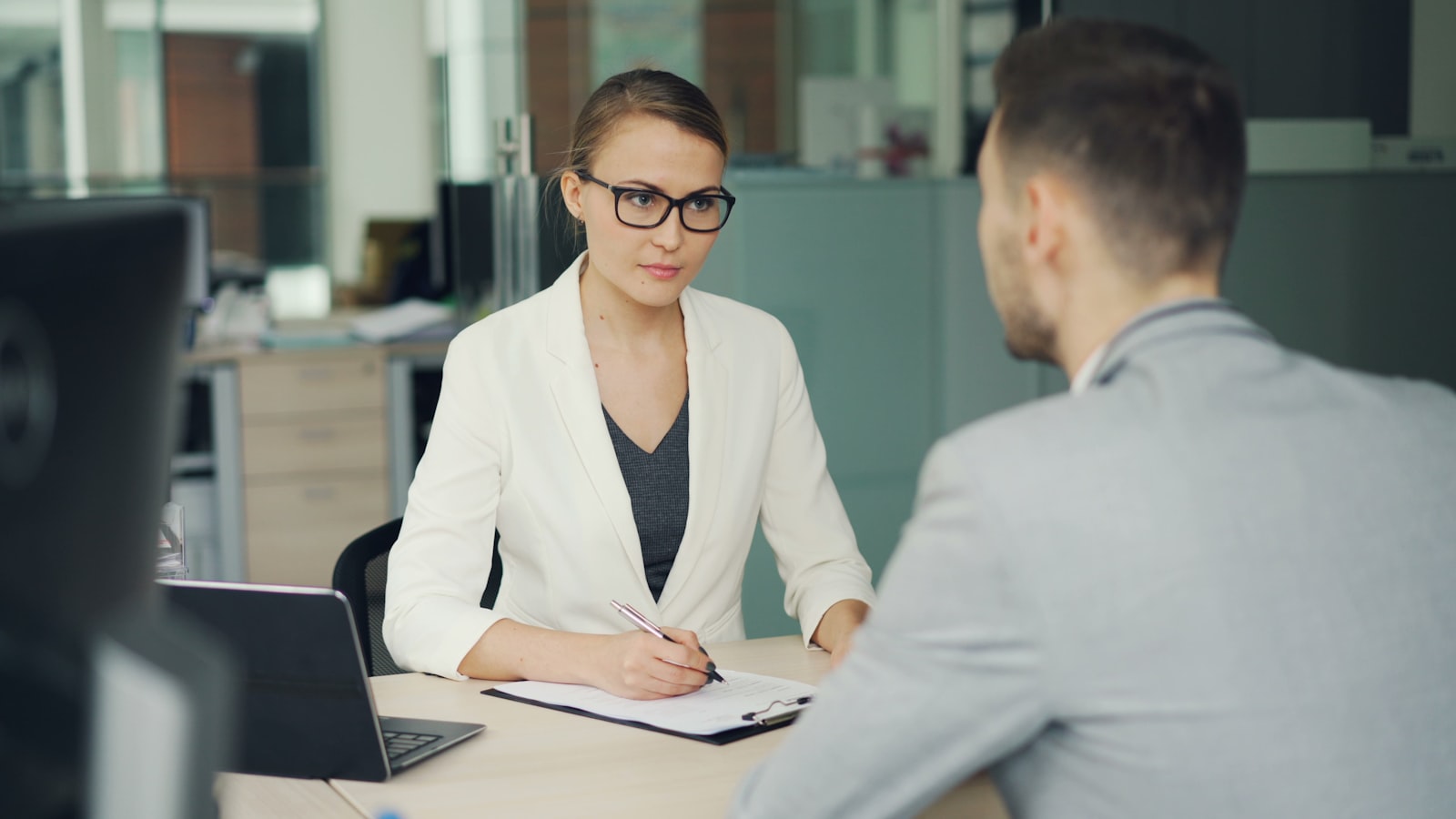 HR professional reviewing documents in an office setting