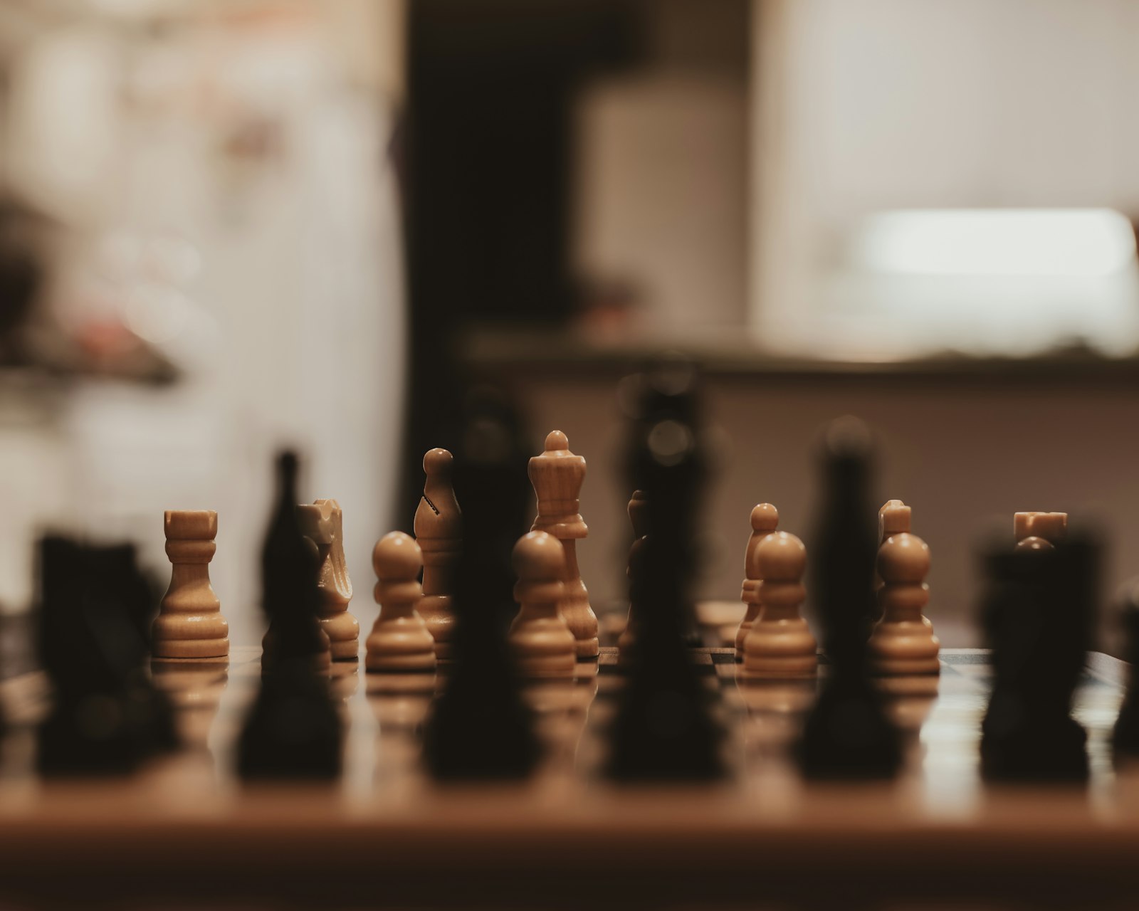 Close-up of a chess board with pieces mid-game representing chess study