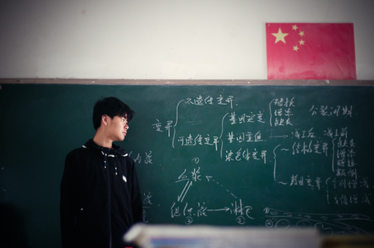 Teacher in front of classroom engaging students with active learning