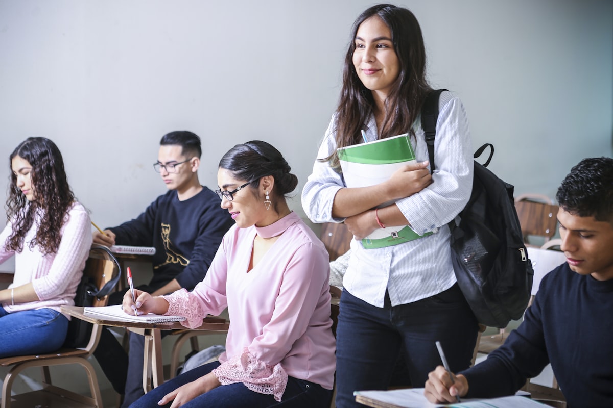 Student reading and annotating a dense textbook