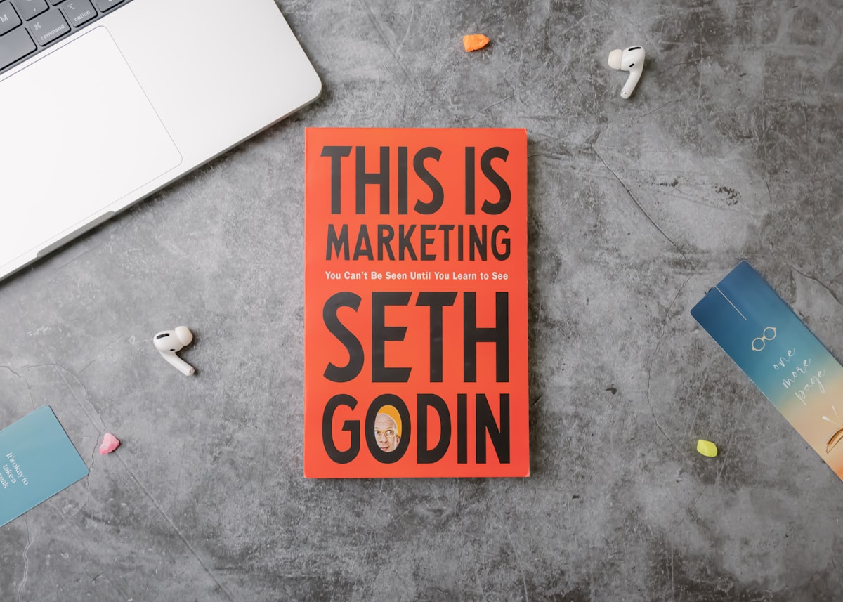 Marketing books and strategy notes on a business desk