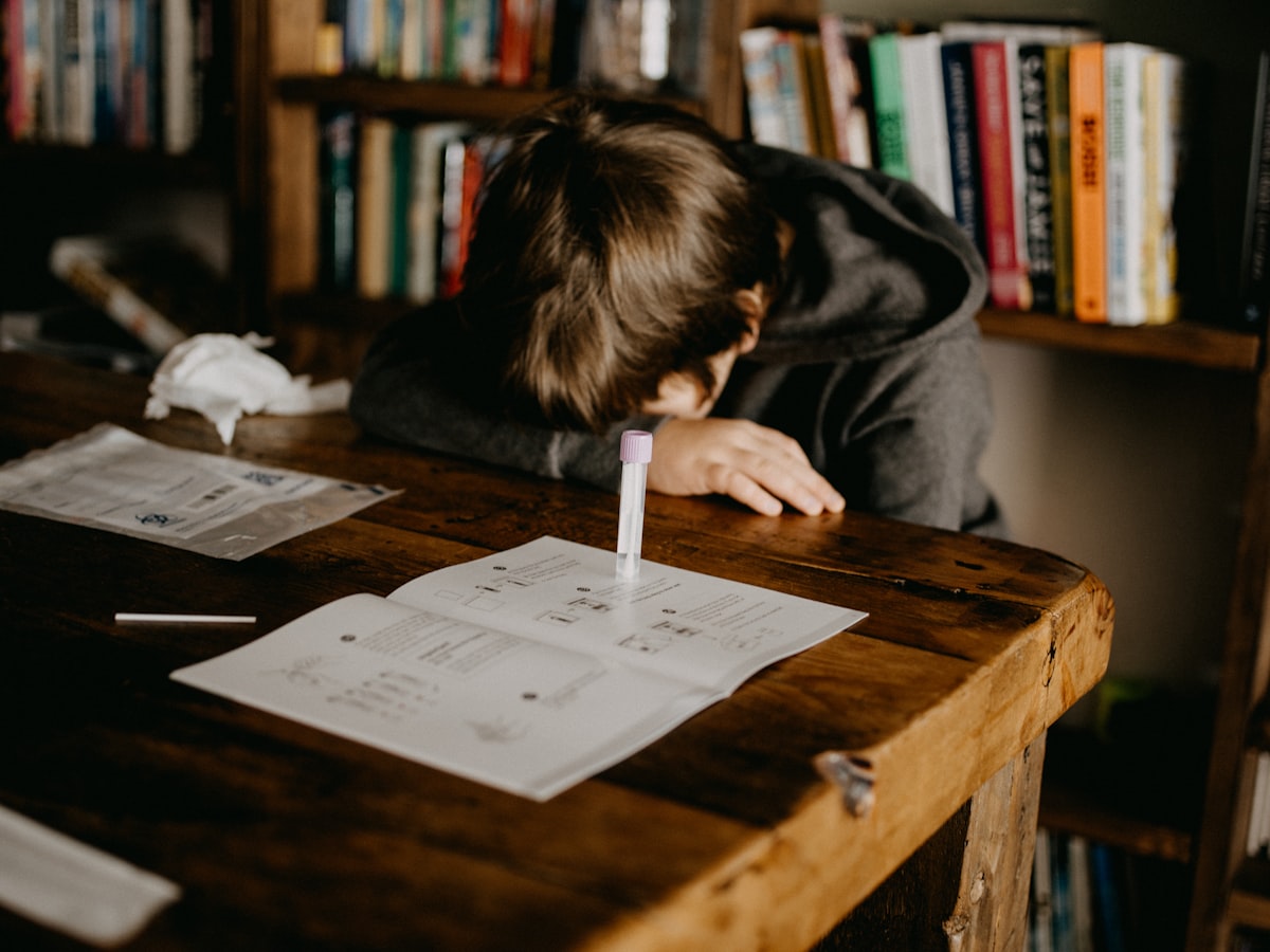 Student reading and studying with books