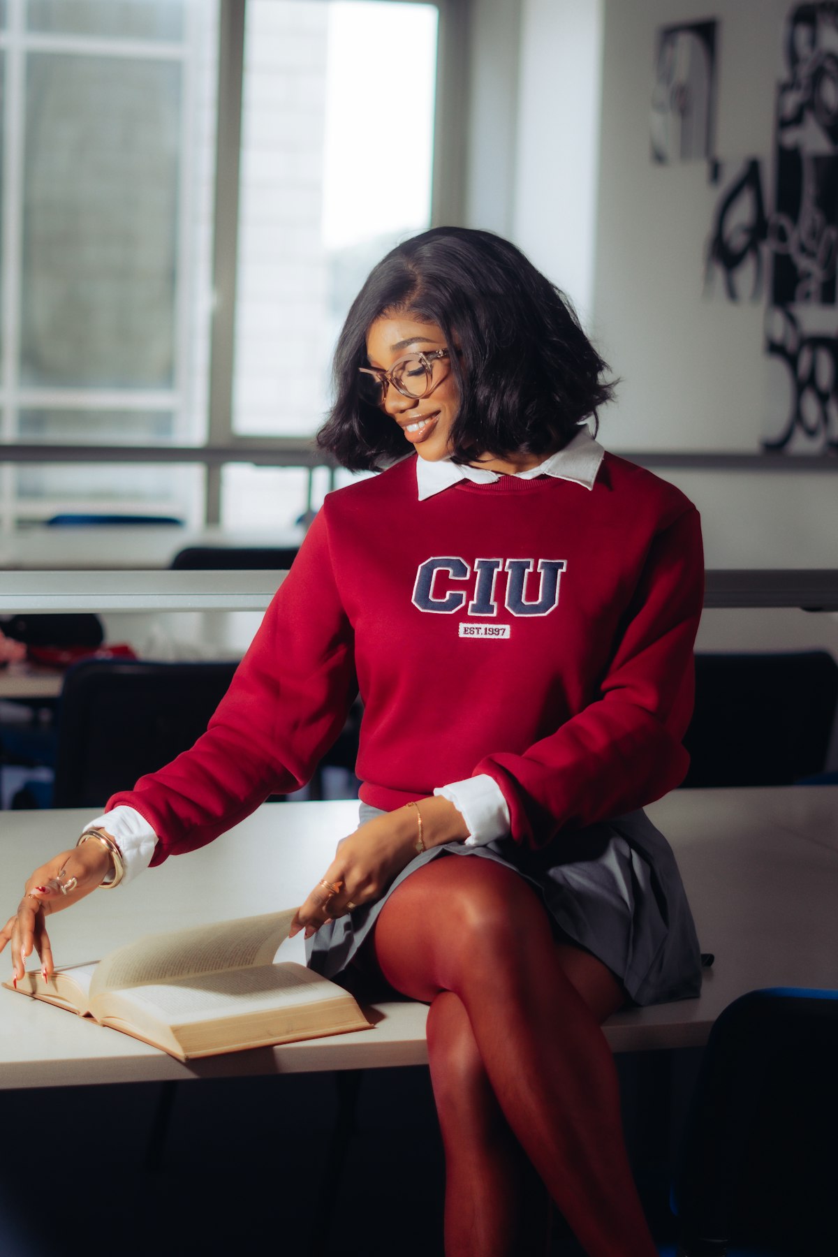 Medical student studying with textbooks and notes spread across a desk